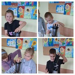 Dzieci wyciskają sok z jabłek za pomocą wyciskarki