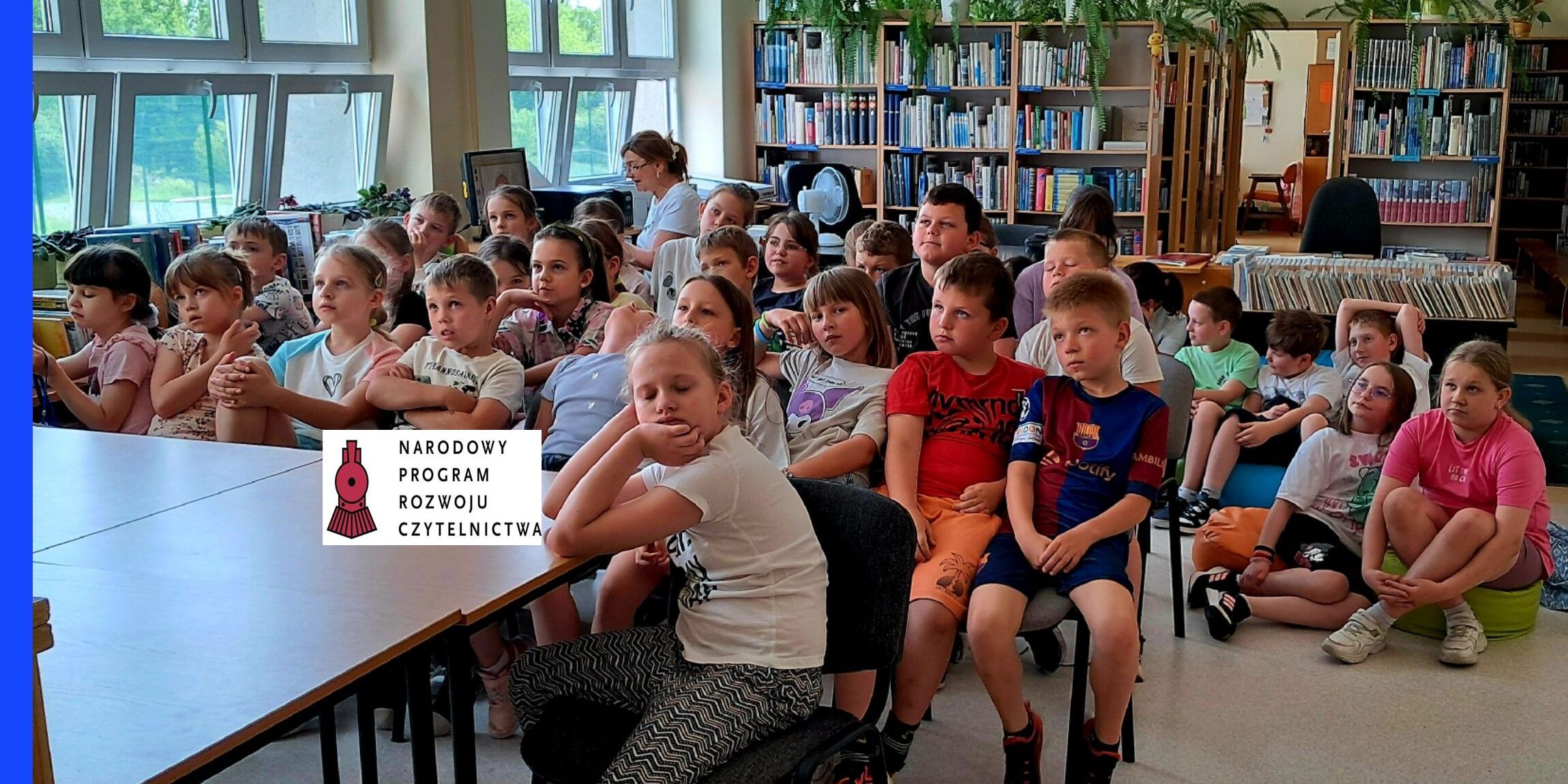 uczniowie klas młodszych na spotkaniu w bibliotece